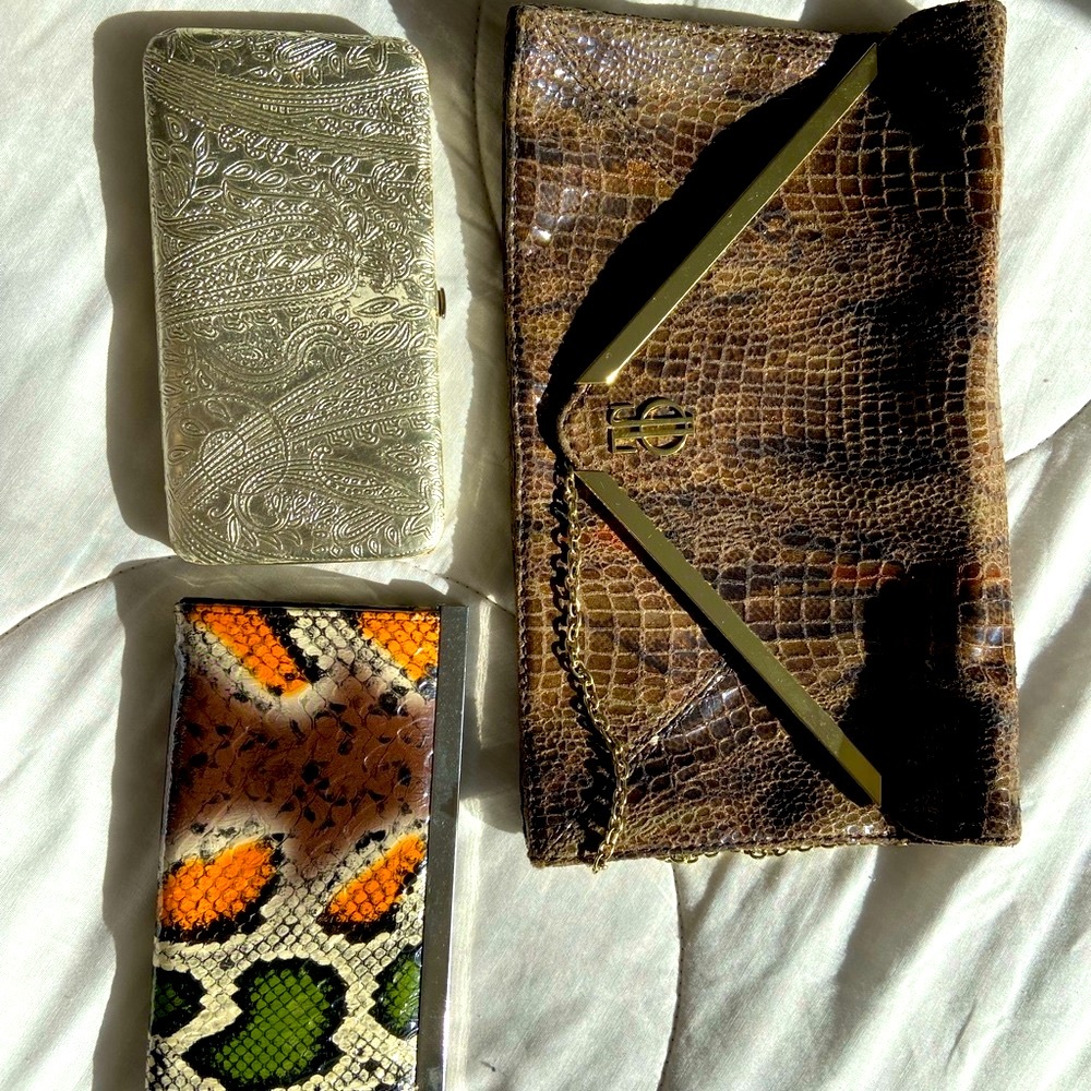 Three clutches one is brand new JLO brand.